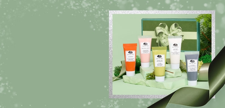 Origins mask holiday set with green festive background